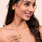 Elegant Gold-Toned Floral Swirl Crystal-Studded Pendant & Earrings Jewellery Set